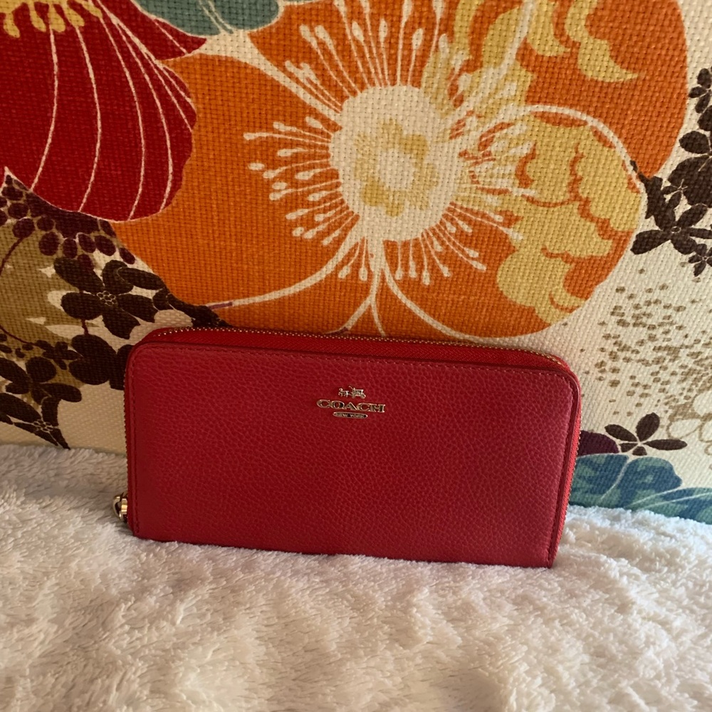 Coach red leather wallet.